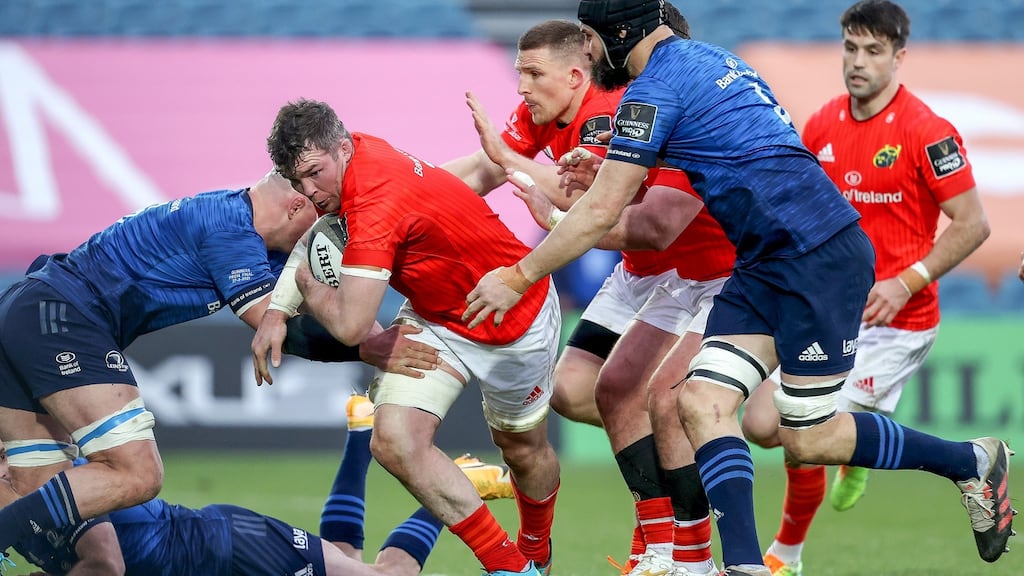 Munster’s Peter O’Mahony is tackled by Rhys Ruddock and Scott Fardy of Leinster during the Guinness Pro 14 Final at the RDS. Photograph: Dan Sheridan/Inpho