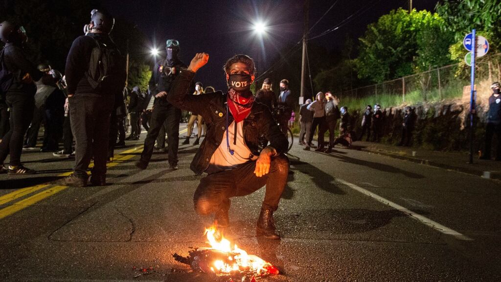 Protesters gather outside the East Side Police Station in Portland, Oregon. The actions came just hours after the head of the Department of Homeland Security called the protesters “violent anarchists”. Photograph: Sean Meagher/The Oregonian via AP