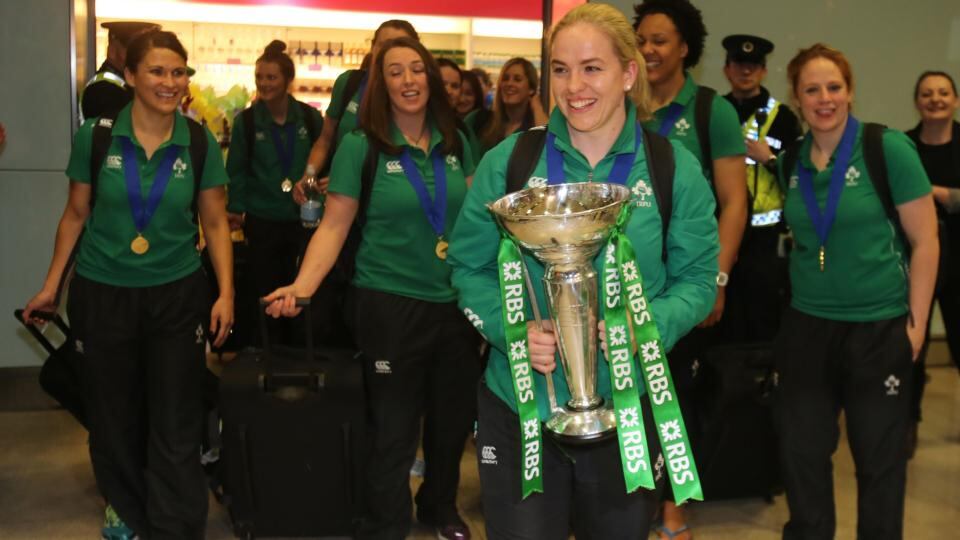 Ireland’s womens’ rugby captain Niamh Briggs holds the Six Nations trophy as she celebrates with fans as the team arrives at Dublin airport. Photograph: Niall Carson/PA Wire