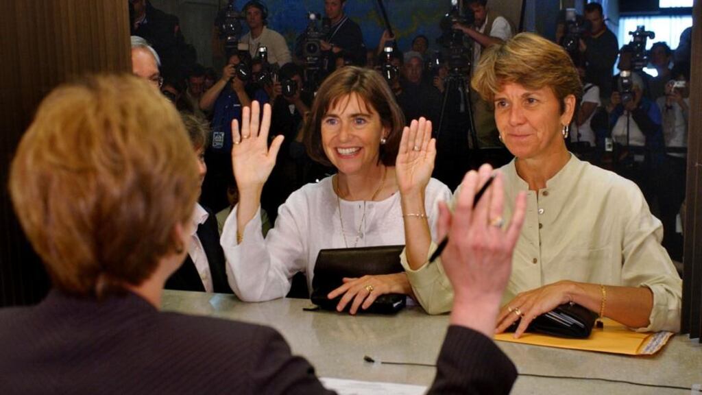 Gay marriage at Boston City Hall: Julie (left) and Hillary Goodridge, with (back to camera) registrar Judith McCarthy. Photograph: AP