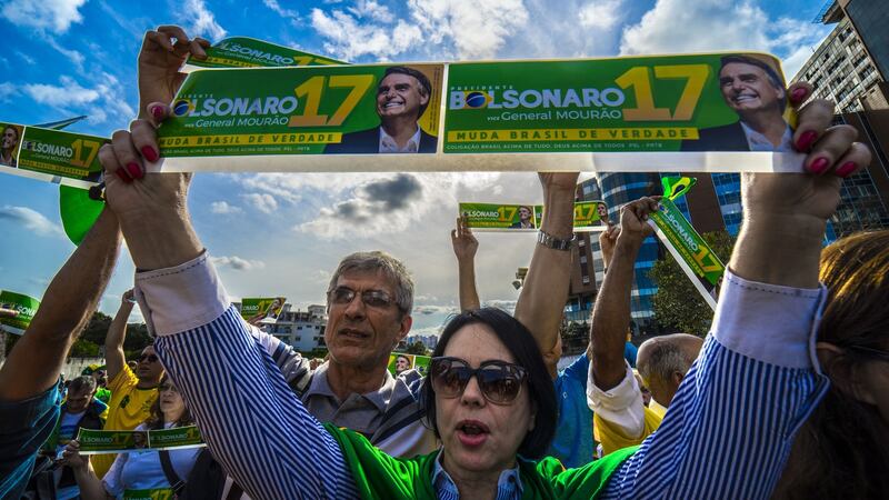 Supporters of Jair Bolsonaro in front of the Israelita Albert Einstein Hospital, Sao Paulo, after it was announced he had left the intensive care unit. Photograph: Cris Faga/NurPhoto via Getty Images