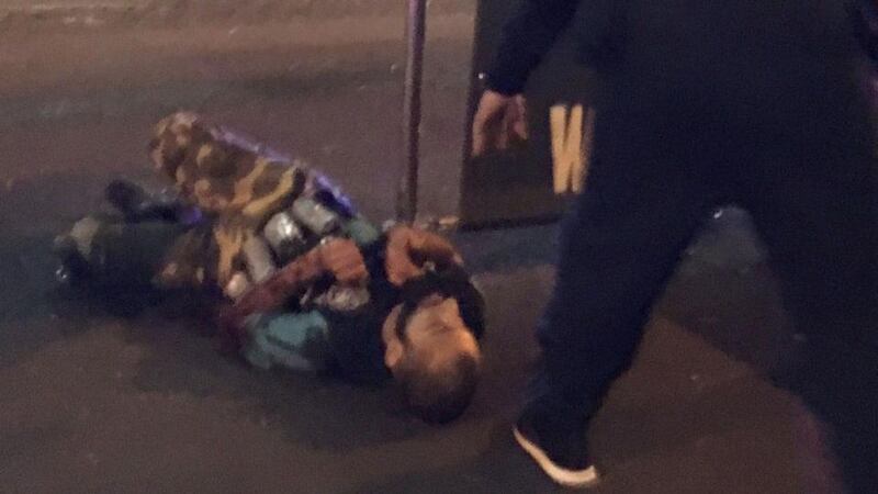London Bridge terror attack: an armed policeman stands over one of the suspects shot outside Borough Market on June 3rd. Photograph: Gabriele Sciotto/AFP/Getty