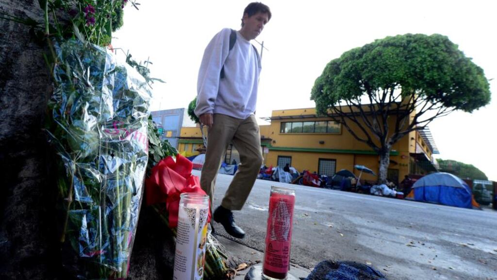 A makeshift memorial at the spot where a homeless man was killed by police in downtown Los Angeles. Photograph: Paul Buck/EPA