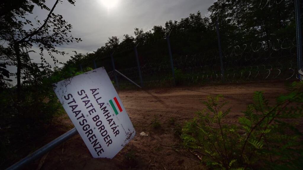 A fallen  border sign   near the  village Asotthalom on the Hungarian-Serbian border after Hungary closed its border in an effort to stem the wave of migrants entering the country. Photograph: Attila Kisbenedek/AFP/Getty  Images