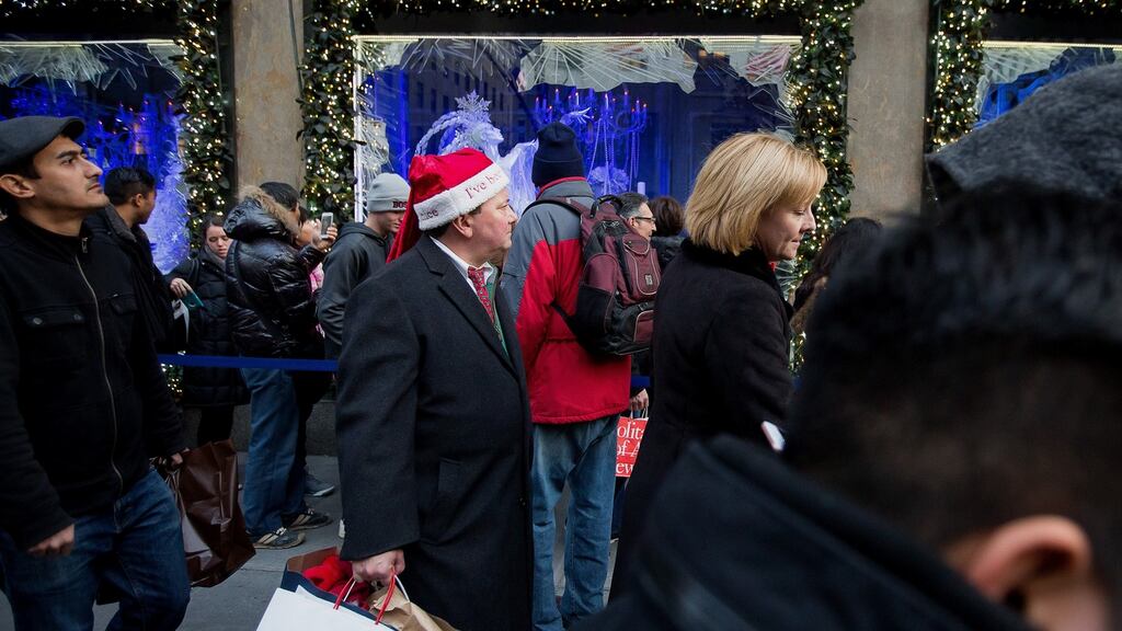 Crowds shopping on Fifth Avenue in New York: businesses accumulated $85.5 billion worth of inventory in the third quarter. Photograph: Michael Nagle/Bloomberg