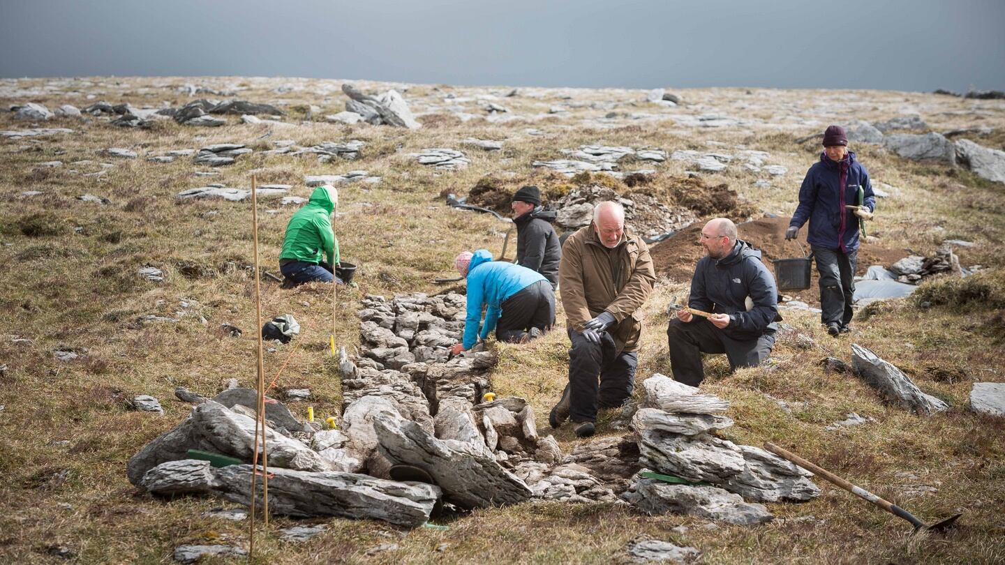Dr Stefan Bergh, Department of Archeology NUI Galway, with Dr Ros Ó Maoldúin, site director and archeologists at their excavation on Turlough Hill in the Burren, Co Clare. Photograph: Eamon Ward