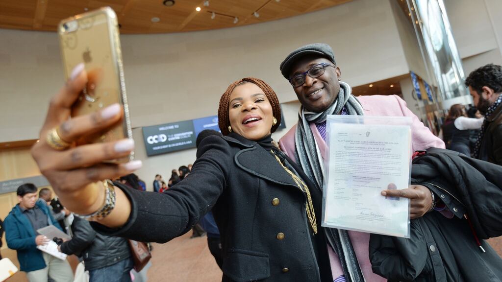 Sonia Akpeuwe Ndukaire and Edmund Chimezie Ndukaire, originally from Nigeria, celebrate Edmund’s Irish citizenship at the Convention Centre in Dublin. Photograph: Alan Betson/The Irish Times
