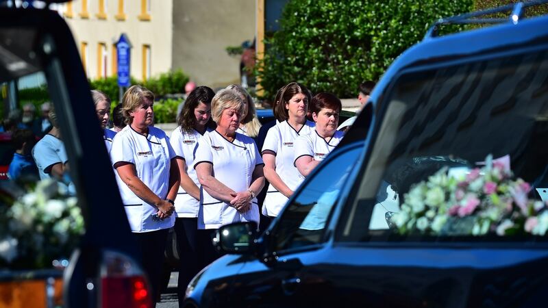 Nurses attend the Funeral of John, Tomas and Amelia Mullan at St Pius X Parish Church in Moville on Monday. Photograph: Colm Lenaghan/Pacemaker