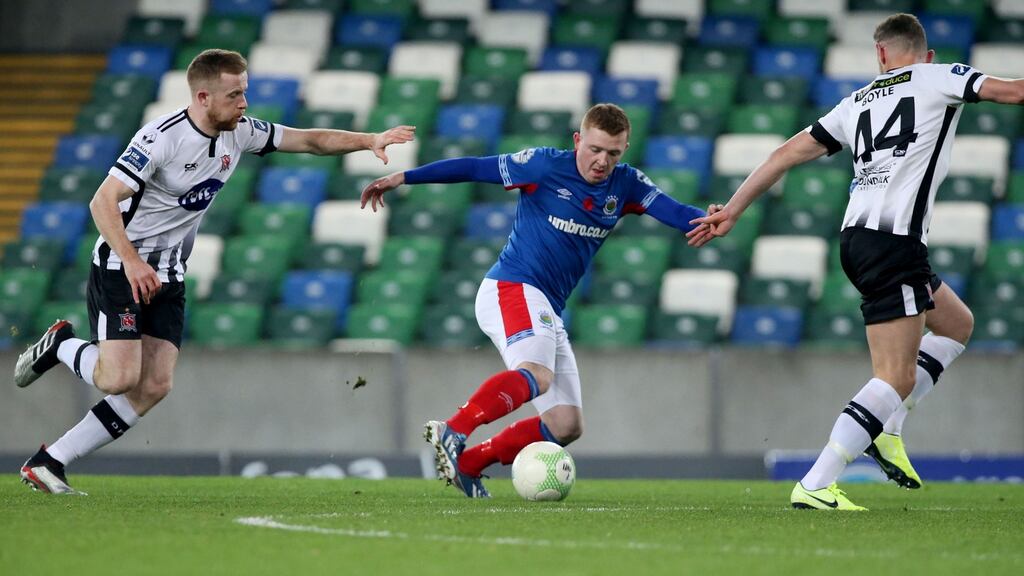 Linfield’s Shayne Lavery in action against Seán Hoare and Andy Boyle of Dundalk during the first leg of the Unite the Union Champions Cup at Windsor Park. Photograph: Brian Little/Inpho