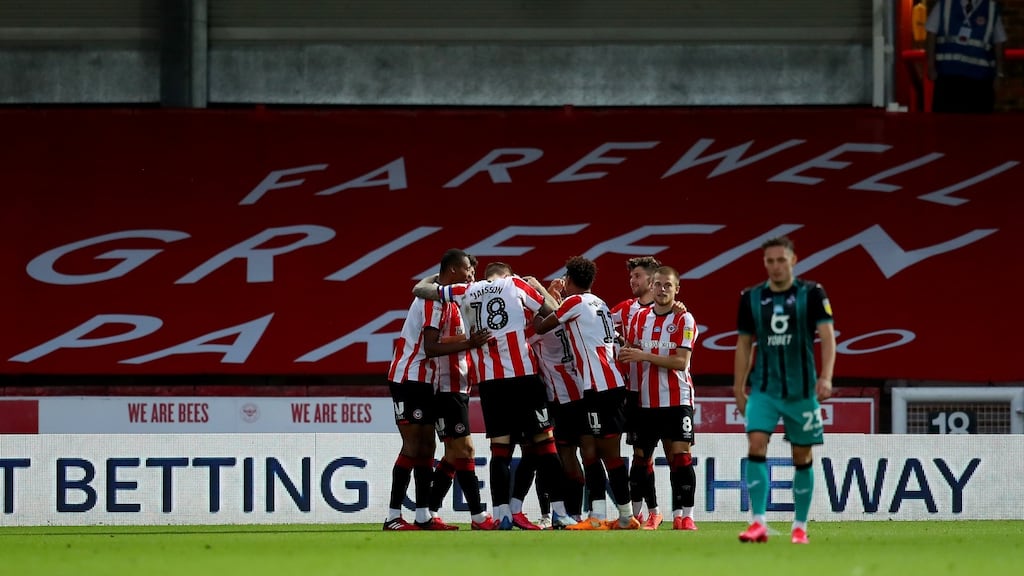 Bryan Mbeumo of Brentford celebrates with his team mates after scoring his team’s third goal during the Sky Bet Championship Play Off Semi-final second leg match between Brentford and Swansea City at Griffin Park. Photo: Catherine Ivill/Getty Images