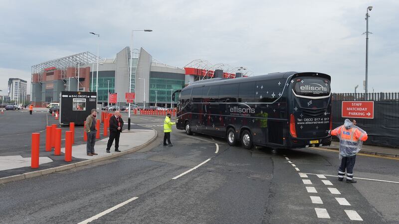 The Liverpool team bus arrives at Old Trafford via a back entrance. Photo: Peter Powell/EPA