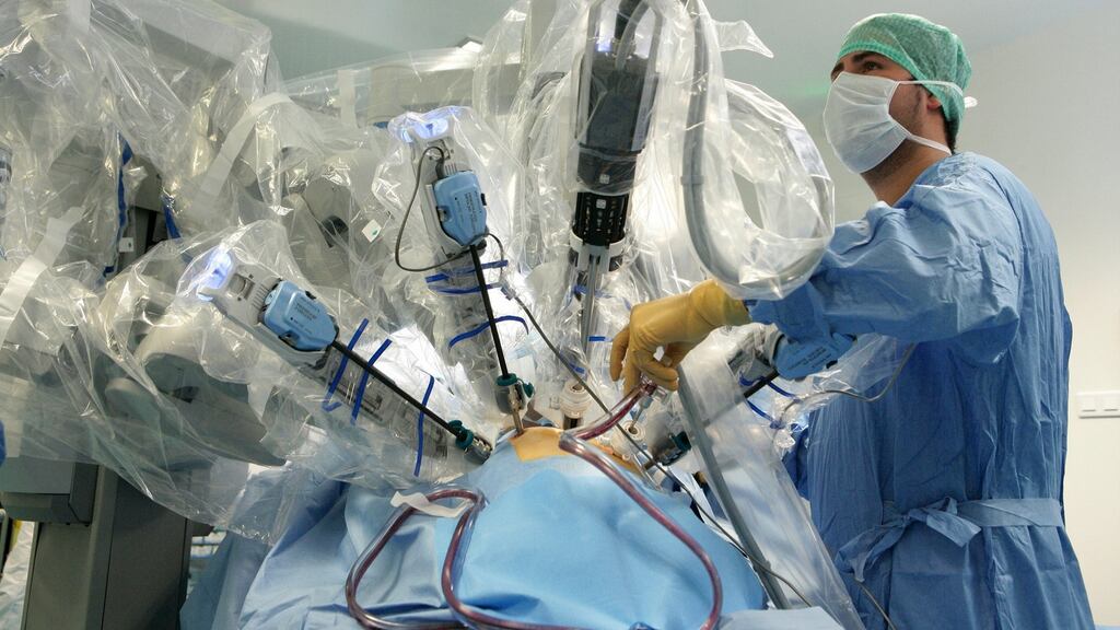 Surgeons at Rouen hospital, France, perform a hysterectomy using the da Vinci robotic surgical assistant. Photograph: BSIP/UIG via Getty Images