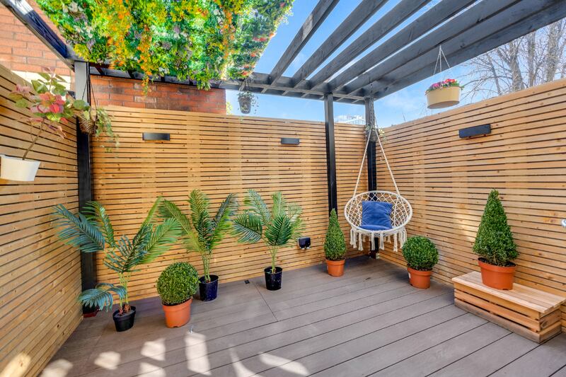 Patio with tub under the deck