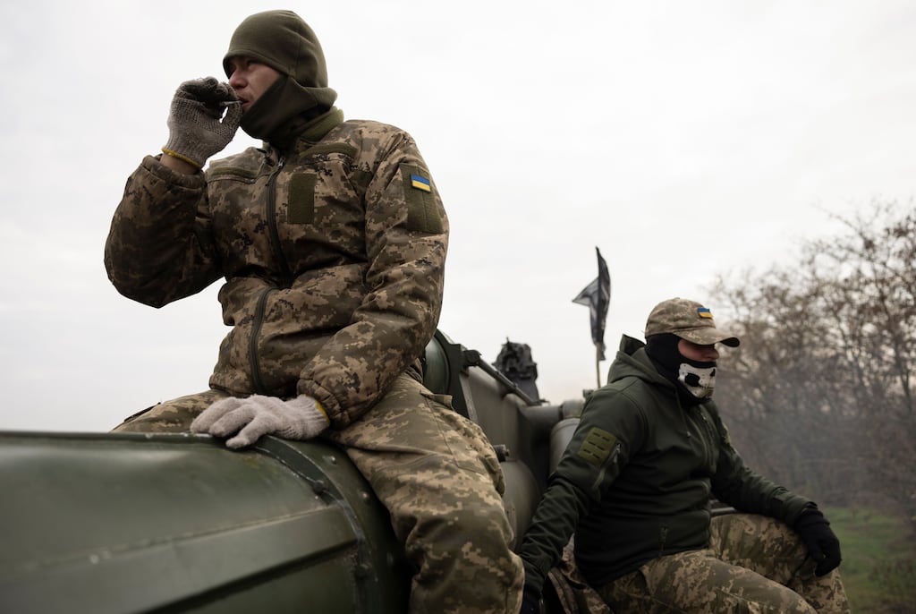 Ukrainian servicemen rest on a self-propelled 203mm cannon 'Pion' in the Kherson area this week. Photograph: Stanislav Kozliuk/EPA