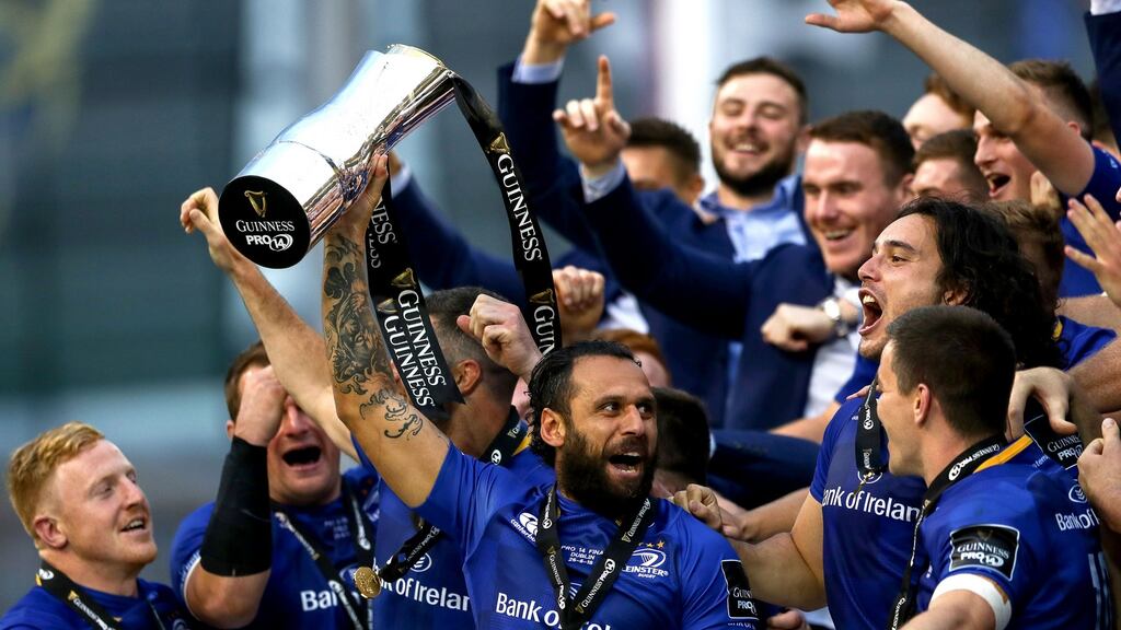 Leinster’s Isa Nacewa lifts the trophy as he celebrates victory in the Pro14 final over Scarlets at the Aviva Stadium, his final game for the province. Photograph: James Crombie/Inpho