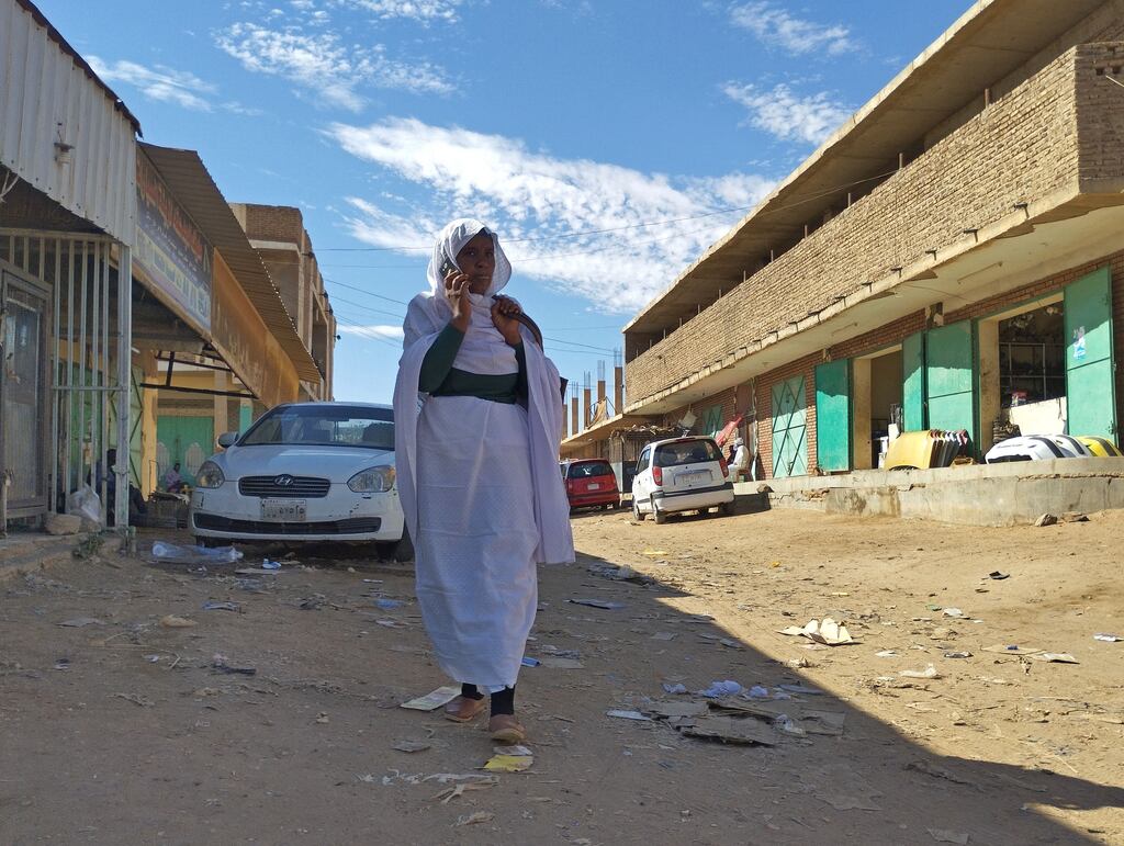 A woman walks in Khartoum on Tuesday as fierce fighting continues between rival generals in Sudan despite the latest truce. Photograph: AFP via Getty Images