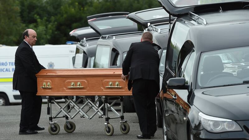 Coffins are taken to hearses at the scene in Oakdene, Barconey, Ballyjamesduff in Co Cavan, where a family of five were found dead in their countryside home. Photograph: Philip Fitzpatrick/PA Wire