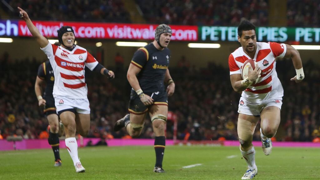 Japan’s Amanaki Lotoahea runs in to score their third try during the match against Wales at The Principality stadium in Cardiff. Photograph: Geoff Caddick/AFP
