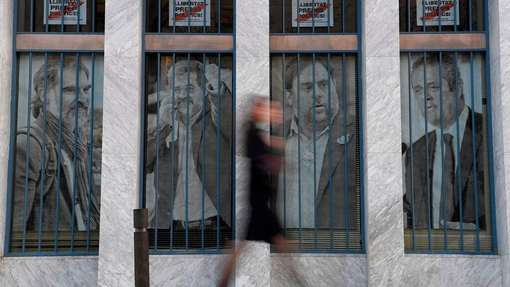 Portraits of Catalan separatists leaders: the case is widely seen as the most important, and politically charged, in Spain’s modern era. Photograph: Luis Gene/AFP/Getty Images