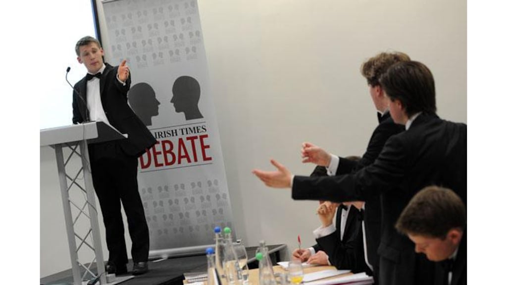 Debate proposition lead speaker Eoin O'Liathain (TCD Phil) opens the the motion 'This House Would Emigrate' at the 2013 Irish Times Debate final held in Queens Universtiy's Riddel Hall, Belfast. Photograph:Charles McQuillan/Pacemaker