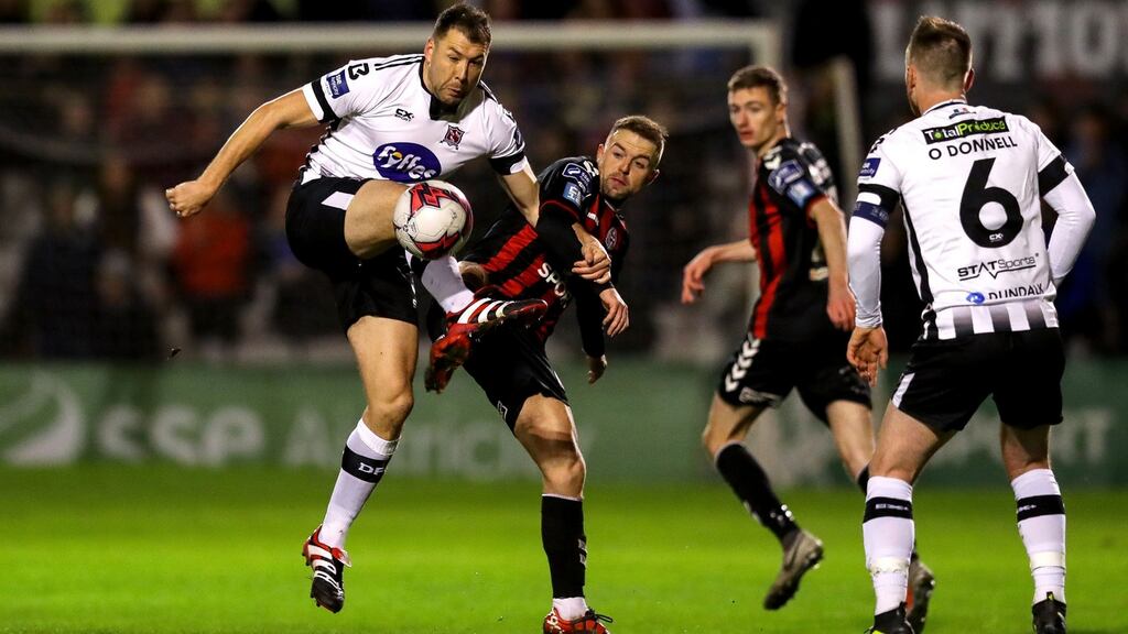 Bohemians’ Keith Ward challenges Brian Gartland of Dundalk during the SSE Airtricity League Premier Division match at Dalymount Park. Photograph: Ryan Byrne/Inpho