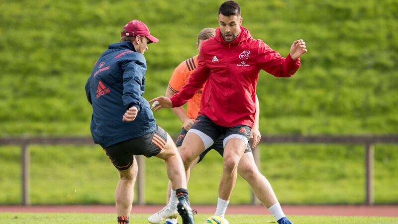 Tyler Blyendaal and Conor Murray play football during Munster training in Limerick. Photo: Morgan Treacy/Inpho