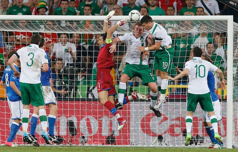 Buffon foils an attempt from Shane Long and Richard Dunne in the Euro 2012 match against Ireland in Poznan. Photograph: Reuters.