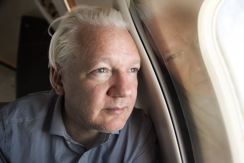 Julian Assange on board a flight to Bangkok after his release from prison in the UK. Photograph: @WikiLeaks/PA Wire