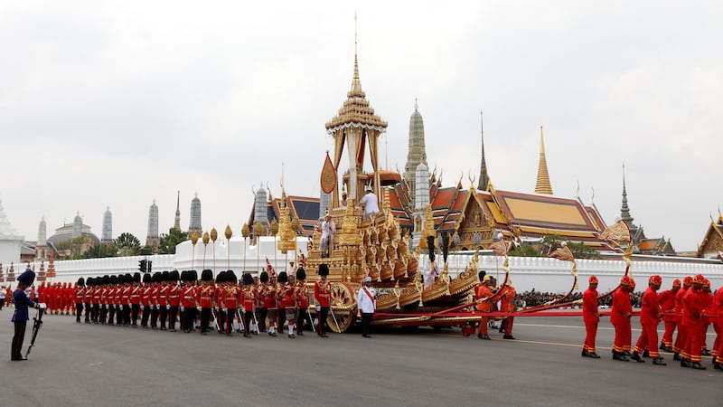 The Great Victory Chariot carrying the urn with theKing’s body is pulled during his funeral procession. Photograph: Soe Zeya Tun/Reuters