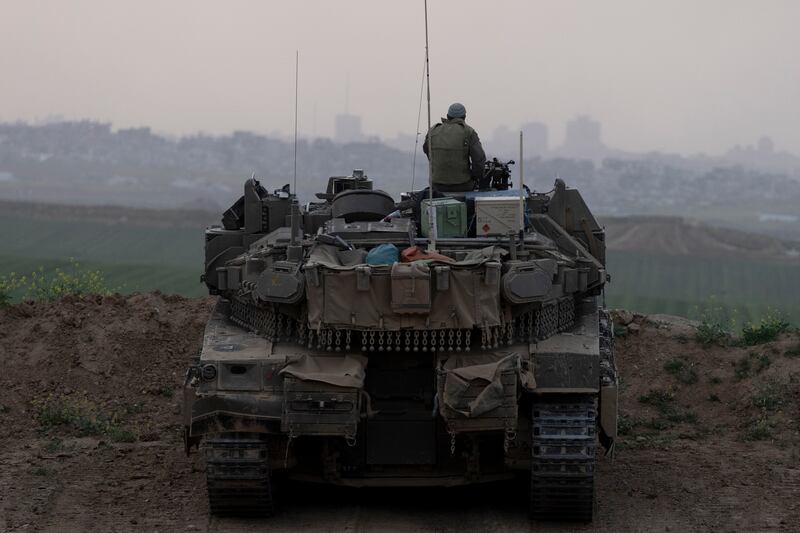 An Israeli tank takes position in front of the northern Gaza Strip on Tuesday. Photograph: Amir Levy/Getty Images