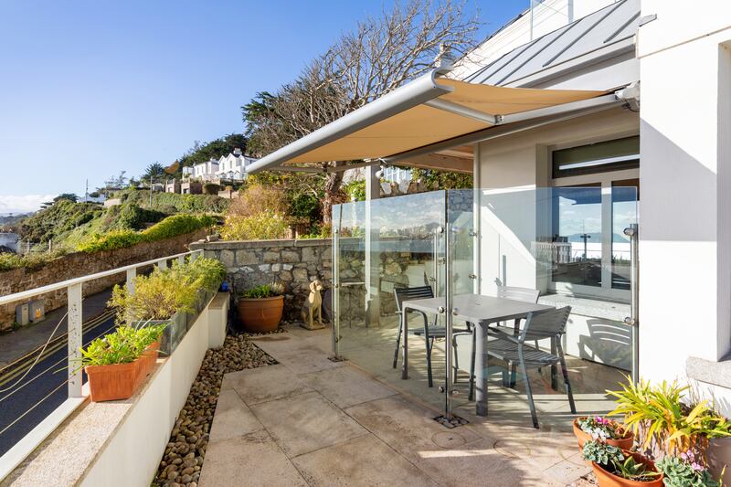 Enclosed dining area on front terrace