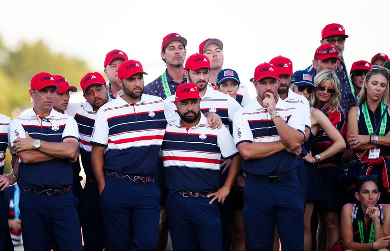 Team USA players stand dejected on the 18th as the singles matches finish up. Photograph: Mike Egerton/PA