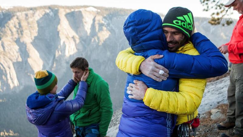 From left: Becca and Tommy Caldwell, and Jacqui Becker and Kevin Jorgeson embrace after the two men completed a free climb summit of the Dawn Wall of El Capitan. Photograph: Max Whittaker/The New York Times
