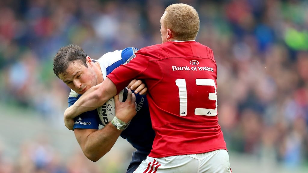 Leinster’s Robbie Henshaw is tackled by Munster’s Keith Earls at the Aviva Stadium. Photograph: James Crombie/Inpho