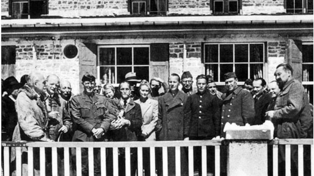 Irishman Major John McGrath is in uniform next to Pastor Martin Niemöller, who famously wrote: “First they came for the communists...” He is holding Sissi, daughter of the former Austrian chancellor, Kurt von Schuschnigg