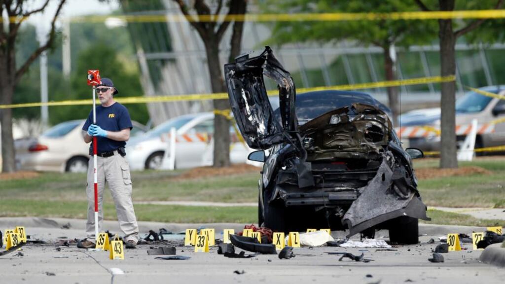 FBI crime scene investigators document evidence outside the Curtis Culwell Center. Two men opened fire with assault weapons on police Sunday night who were guarding a contest for Muslim Prophet Muhammed cartoons. A police officer returned fire killing both men. Photograph: Brandon Wade/AP