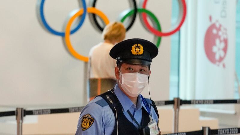 A Japanese policeman stands guard at the arrivals area of Tokyo International Airport at Haneda, Japan. Photograph: Kimimasa Mayama/EPA