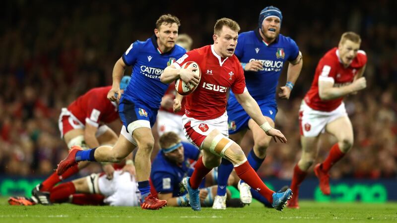 Nick Tompkins breaks away to score Wales’ third try at the Principality Stadium. Photograph: Getty Images