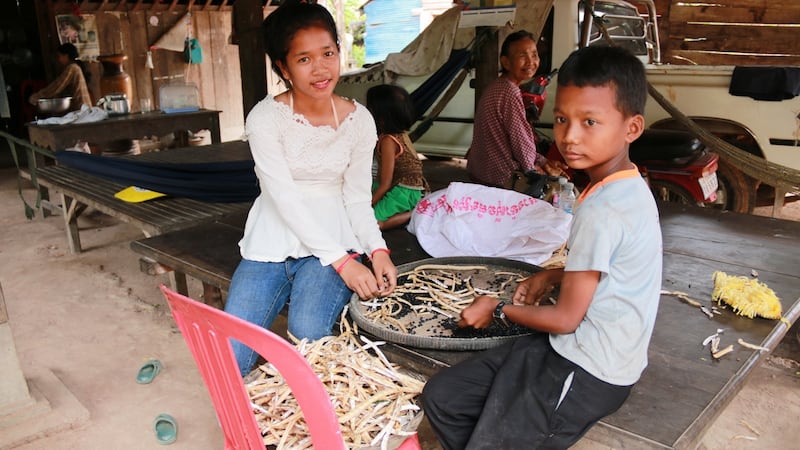 Im Chaem with some of her grandchildren at home near Anlong Veng in northern Cambodia. Photograph: Nevenka Lukin