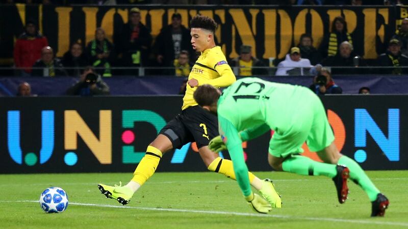 Jadon Sancho of Borussia Dortmund scores his team’s third goal during the Group A match against Atletico Madrid at Signal Iduna Park in Dortmund. Photograph: Christof Koepsel/Bongarts/Getty Images