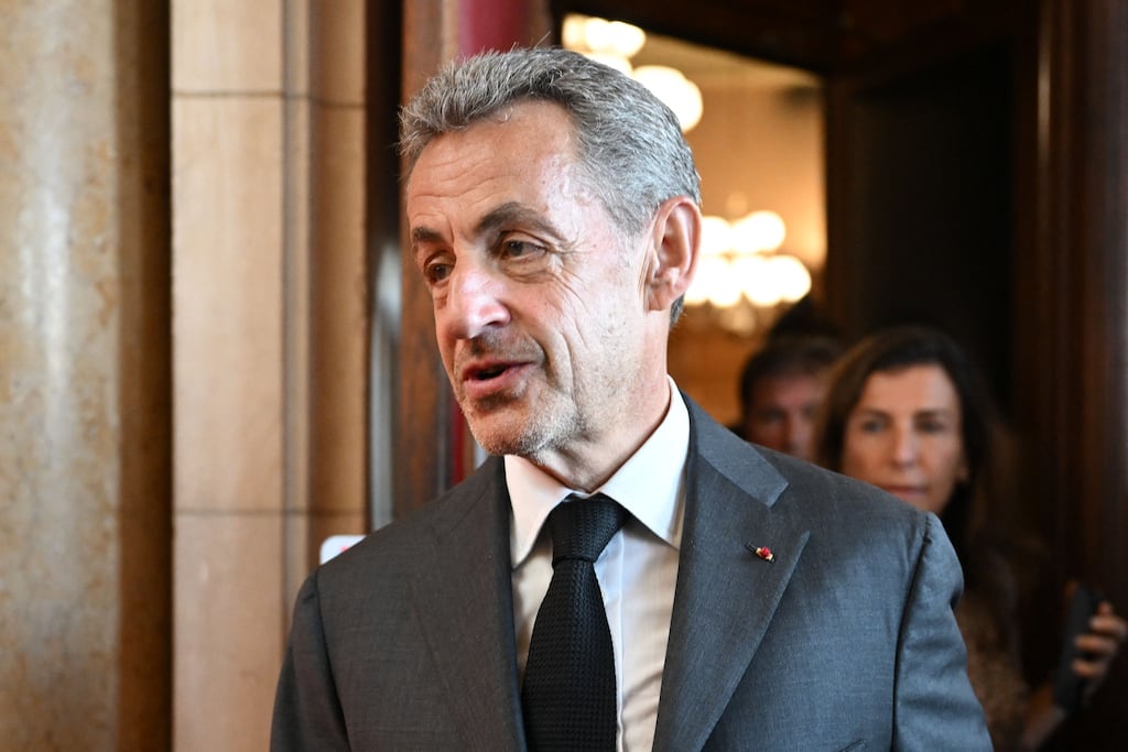 Former French president Nicolas Sarkozy leaves the courthouse after the ruling in his appeal trial in a corruption case. Photograph: BERTRAND GUAY/AFP via Getty Images