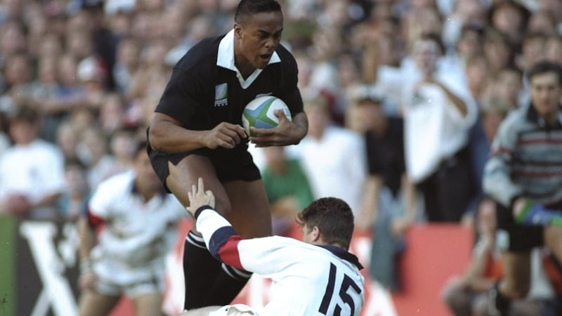 Jonah Lomu runs through England fullback Mike Catt on the way to scoring a try during the 1995 Rugby World Cup semi-final in Cape Town. Photograph: Ben Radford /Allsport
