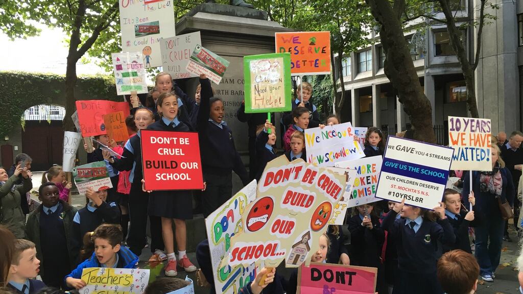 Children from St Mochtas national school protest on Kildare Street over the condition of their school in Dublin 15. Photograph: Dan Griffin/The Irish Times