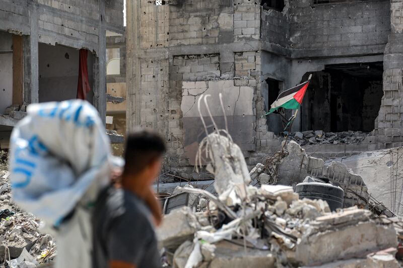 A man views a tattered Palestinian flag flying in a ruined building in Khan Yunis in the southern Gaza Strip on September 16th. Photograph: Bashar Taleb/AFP via Getty