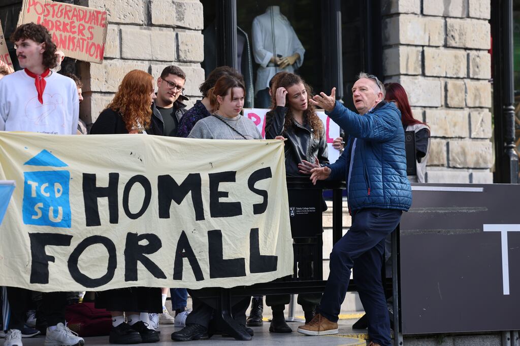 A Trinity College Dublin official speaking to students gathered at the entrance to the Book of Kells exhibition on September 13th to protest against the student accommodation crisis. Photograph: Dara Mac Dónaill