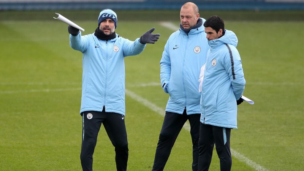 Manchester City manager Pep Guardiola with his assistants during a training session ahead of their Carabao Cup final against Chelsea. Photograph: PA Wire