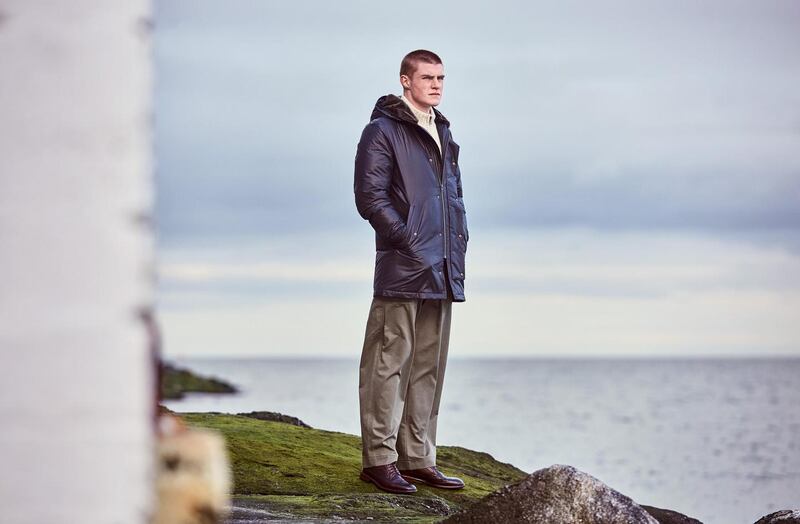 Paul Smith Collection: down-filled location coat with chunky zip-fronted cardigan worn with wide cotton trousers. Photograph: James Mooney