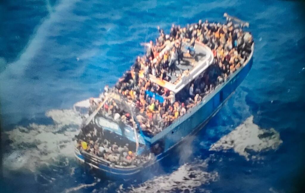 A fishing boat crammed to the gunwales with migrants trying to reach Europe capsized and sank on Wednesday off the coast of Greece. Photograph: Hellenic Coast Guard/AP