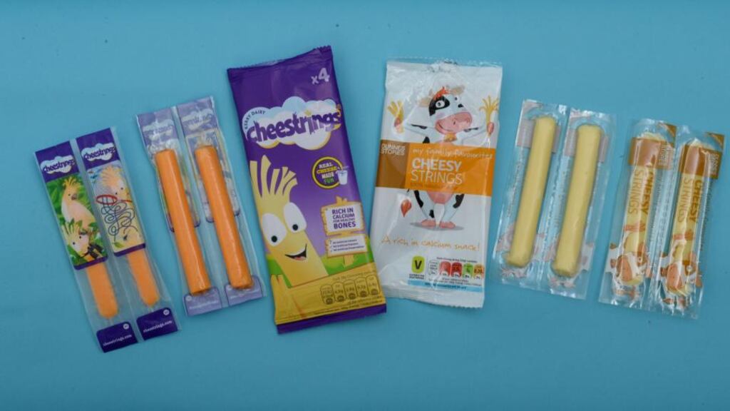 Cheestrings from the Kerry Group (left) and Cheesy Strings from Dunnes Stores. Photograph: Dara Mac Donaill/The Irish Times