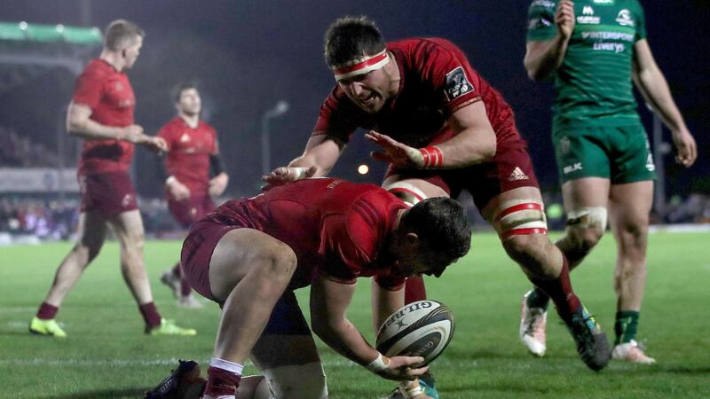 Dan Goggin crosses for Munster in the second half of their win in Galway. Photograph: Bryan Keane/Inpho